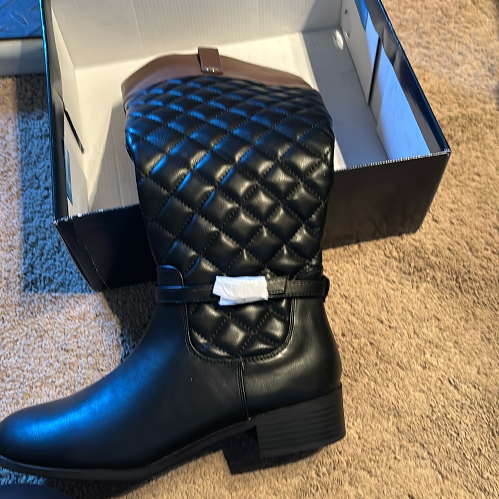 Black boots with brown trim